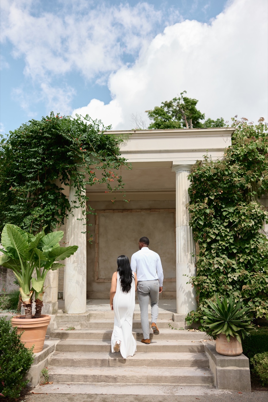 Chithma and Christian walking up garden steps together